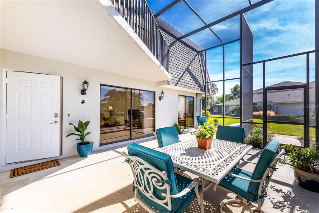 3021 Matecumbe Key Road, Unit 4 Punta Gorda, FL 33955 - Photo 2 of 42 a view of an outdoor dining space with a table and chairs