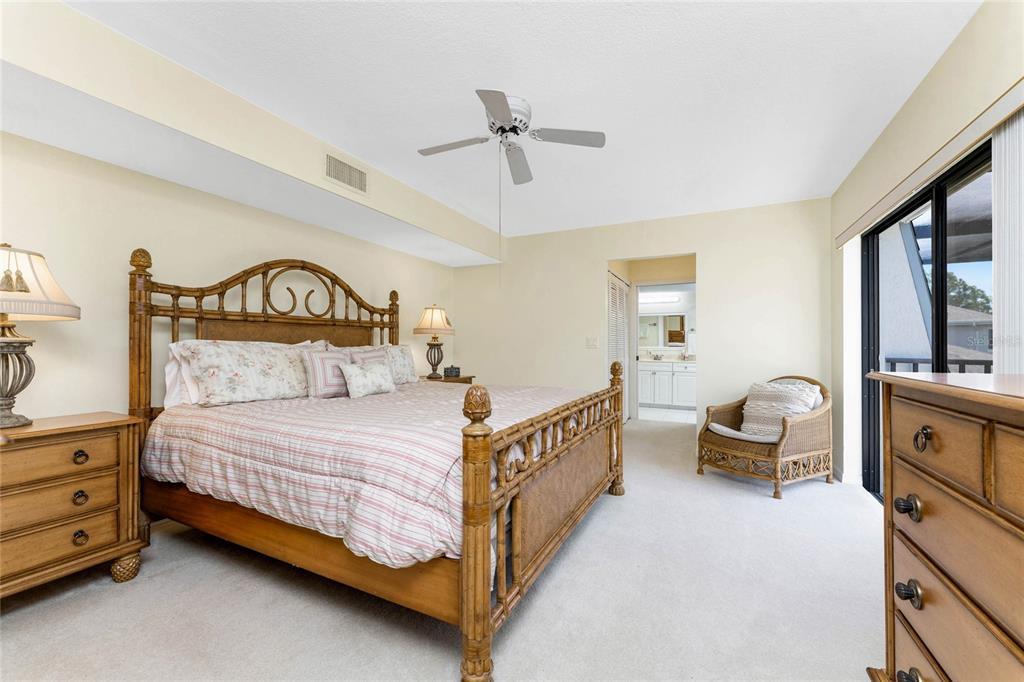 3021 Matecumbe Key Road, Unit 4 Punta Gorda, FL 33955 - Photo 23 of 42 a bedroom with a bed and ceiling fan