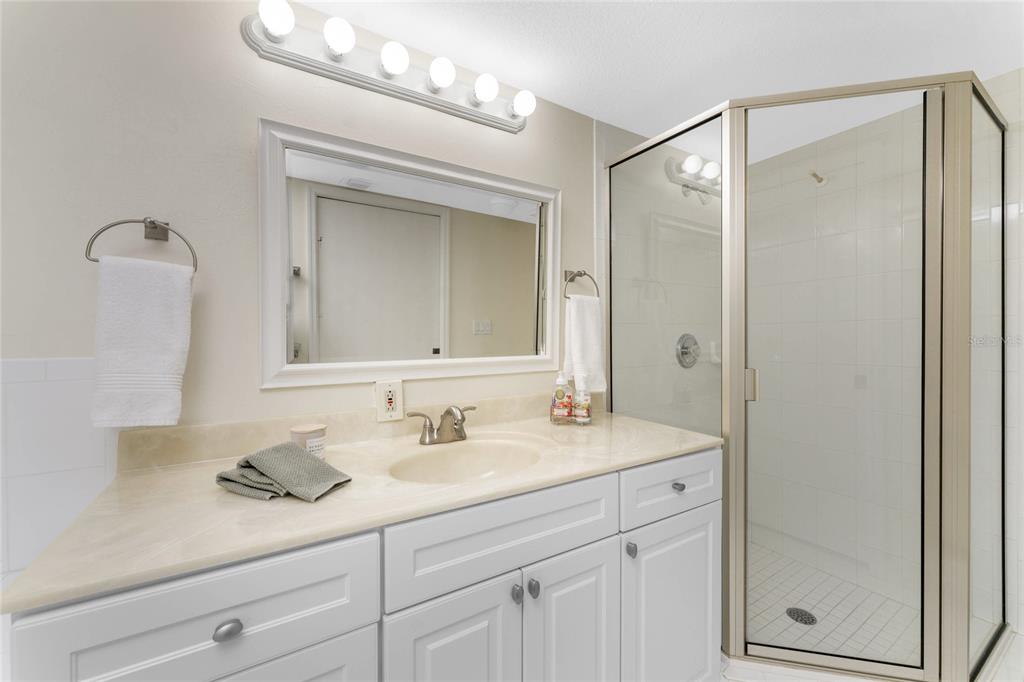 3021 Matecumbe Key Road, Unit 4 Punta Gorda, FL 33955 - Photo 25 of 42 a bathroom with a sink double vanity and a mirror