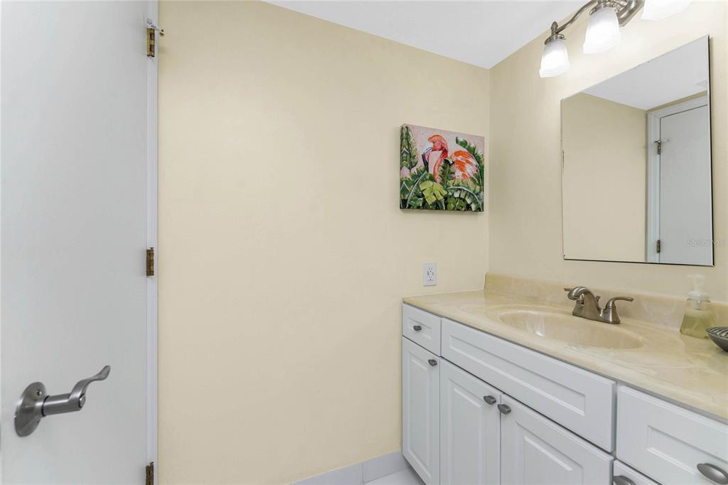 3021 Matecumbe Key Road, Unit 4 Punta Gorda, FL 33955 - Photo 31 of 42 a bathroom with a sink and a mirror