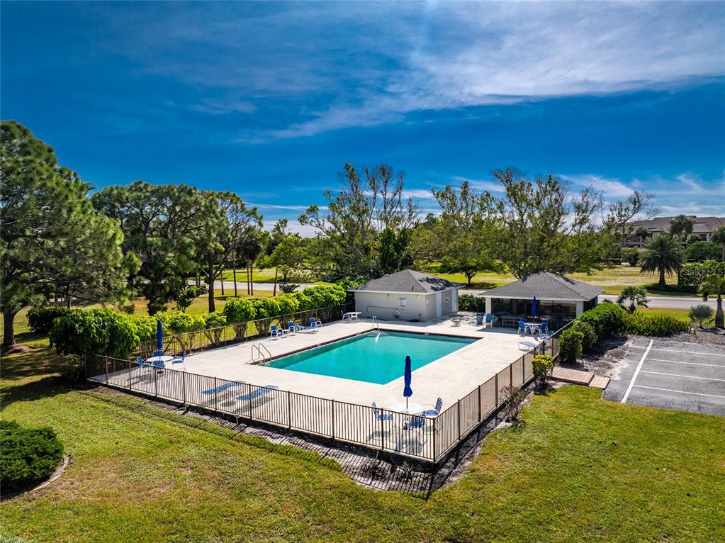 3021 Matecumbe Key Road, Unit 4 Punta Gorda, FL 33955 - Photo 39 of 42 a swimming pool with outdoor seating and yard
