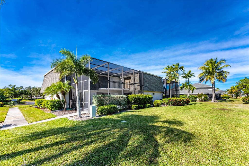 3021 Matecumbe Key Road, Unit 4 Punta Gorda, FL 33955 - Photo 40 of 42 a view of a house with a swimming pool