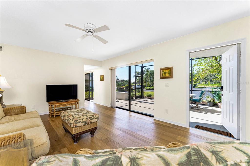 3021 Matecumbe Key Road, Unit 4 Punta Gorda, FL 33955 - Photo 7 of 42 a living room with furniture and a flat screen tv