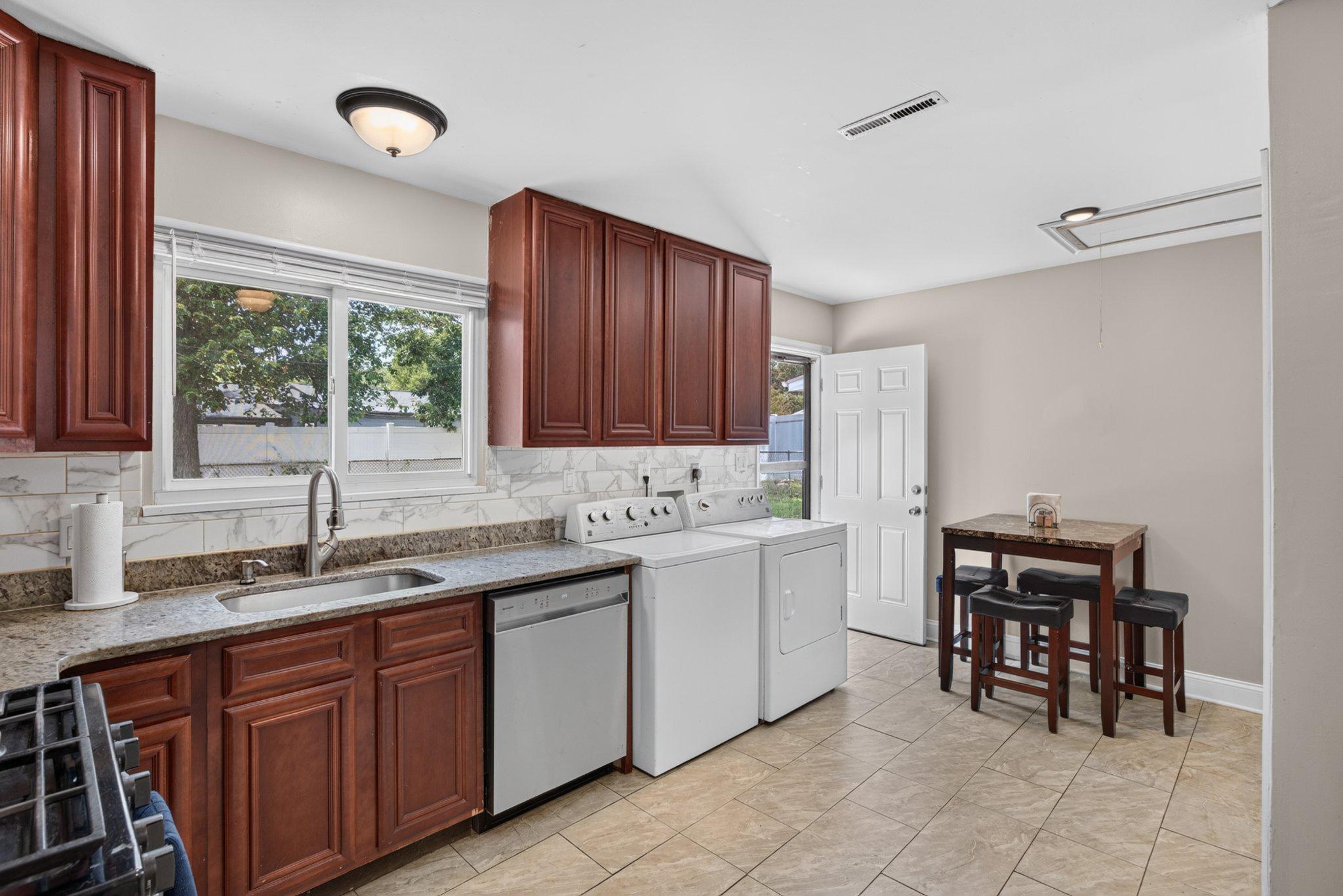 2106 North Rolling Road Windsor Mill, MD 21244 - Photo 8 of 24 Bright kitchen overlooks the backyard
