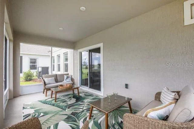 a living room with furniture and a window