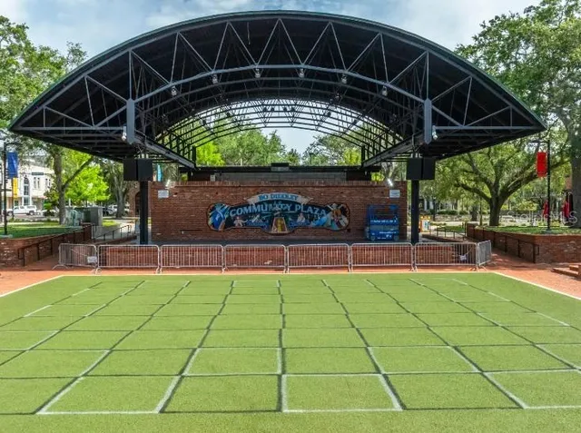 a view of a chairs and table under an umbrella