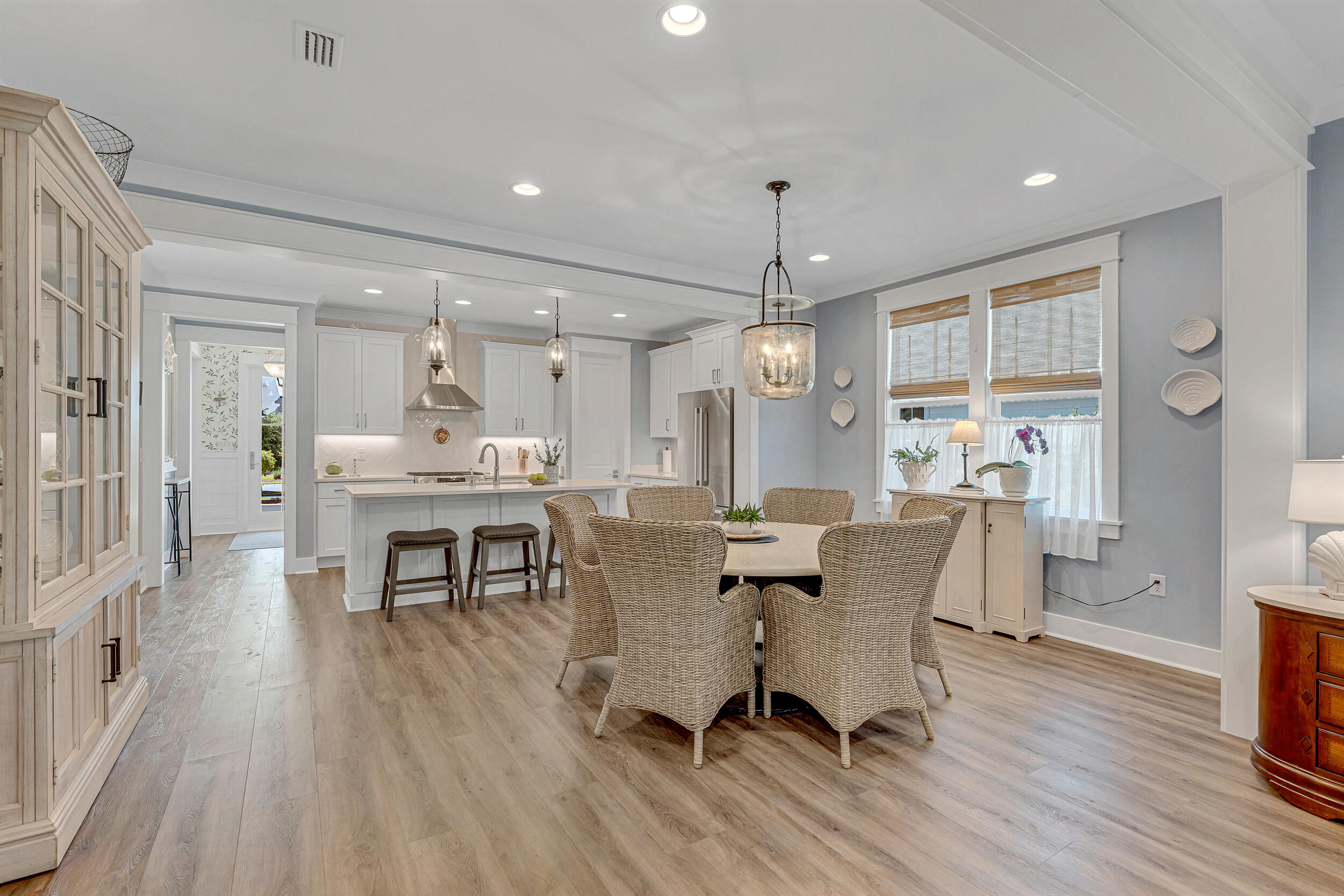 137 Sidecamp Road Watersound, FL 32461 - Photo 23 of 63 a view of a dining room with furniture and wooden floor