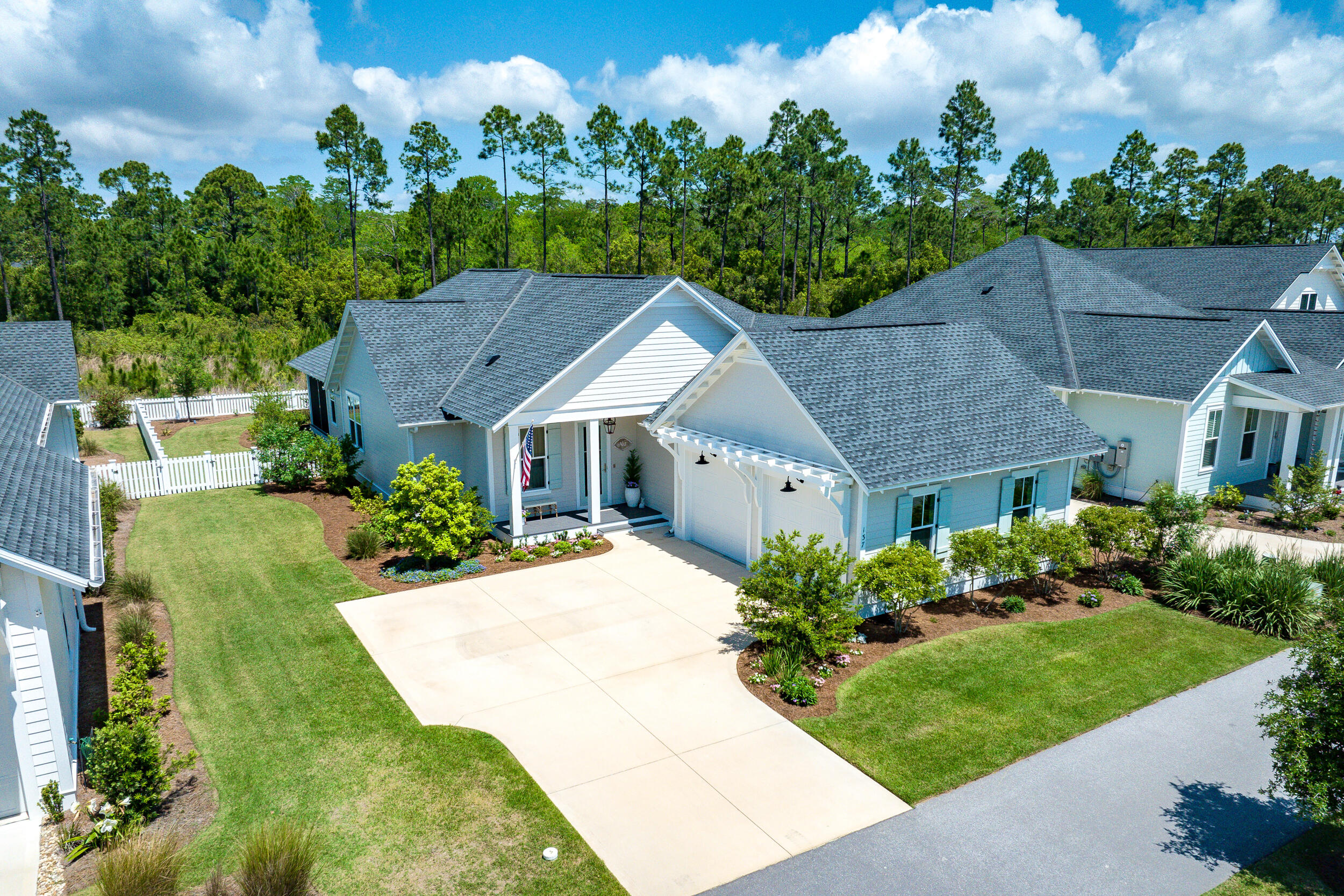 137 Sidecamp Road Watersound, FL 32461 - Photo 4 of 63 a aerial view of a house with a yard plants and large tree