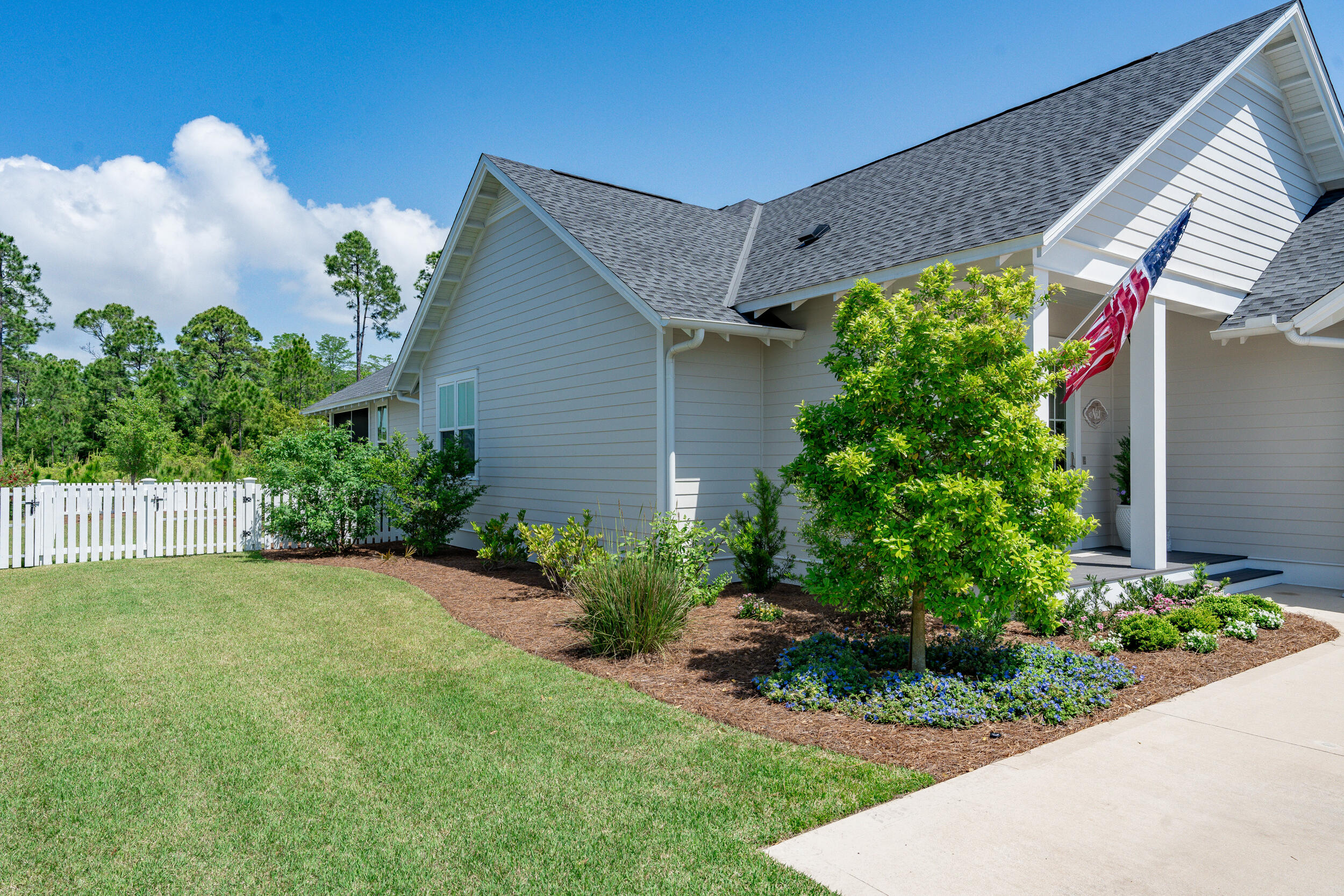 137 Sidecamp Road Watersound, FL 32461 - Photo 47 of 63 a view of a house with a yard and plants