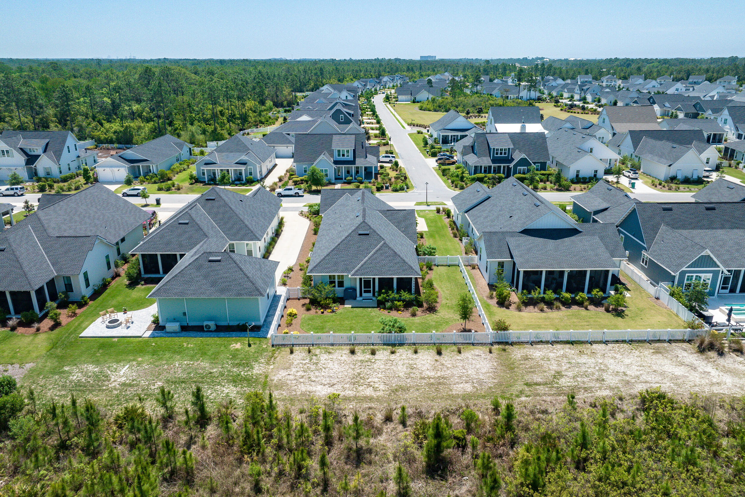 137 Sidecamp Road Watersound, FL 32461 - Photo 56 of 63 an aerial view of residential houses with outdoor space and swimming pool