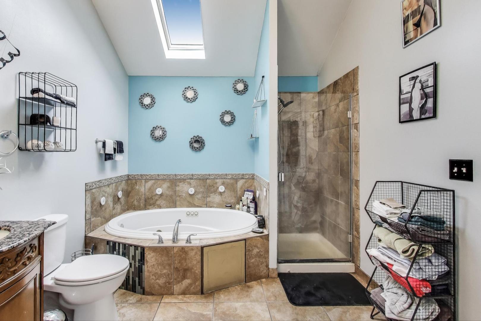 8618 South Morgan Street Chicago, IL 60620 - Photo 12 of 27 a bathroom with a sink toilet and shower