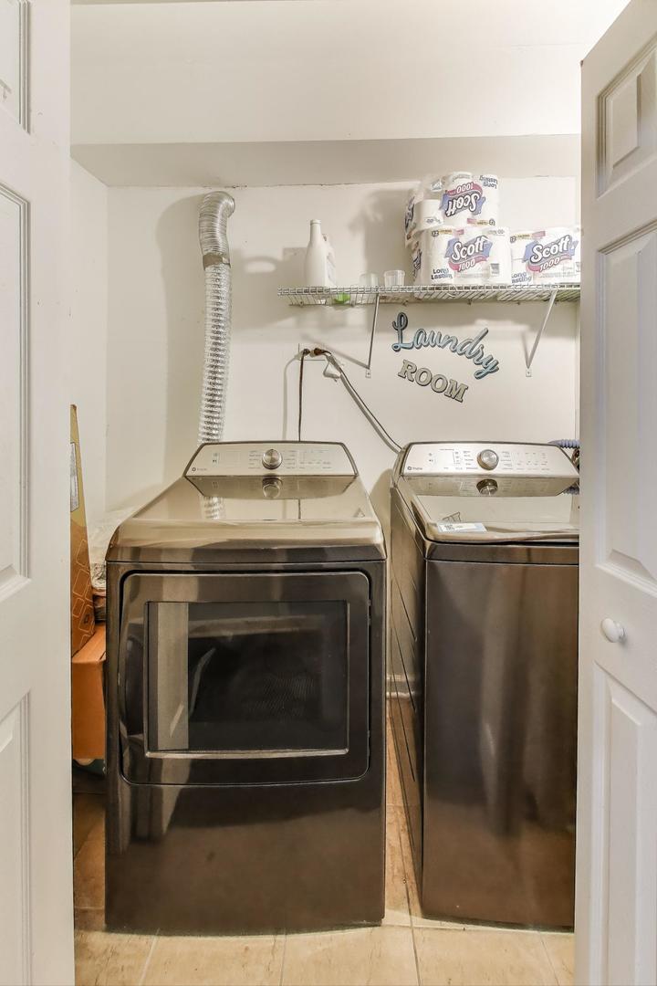 8618 South Morgan Street Chicago, IL 60620 - Photo 21 of 27 a stove top oven sitting inside of a kitchen