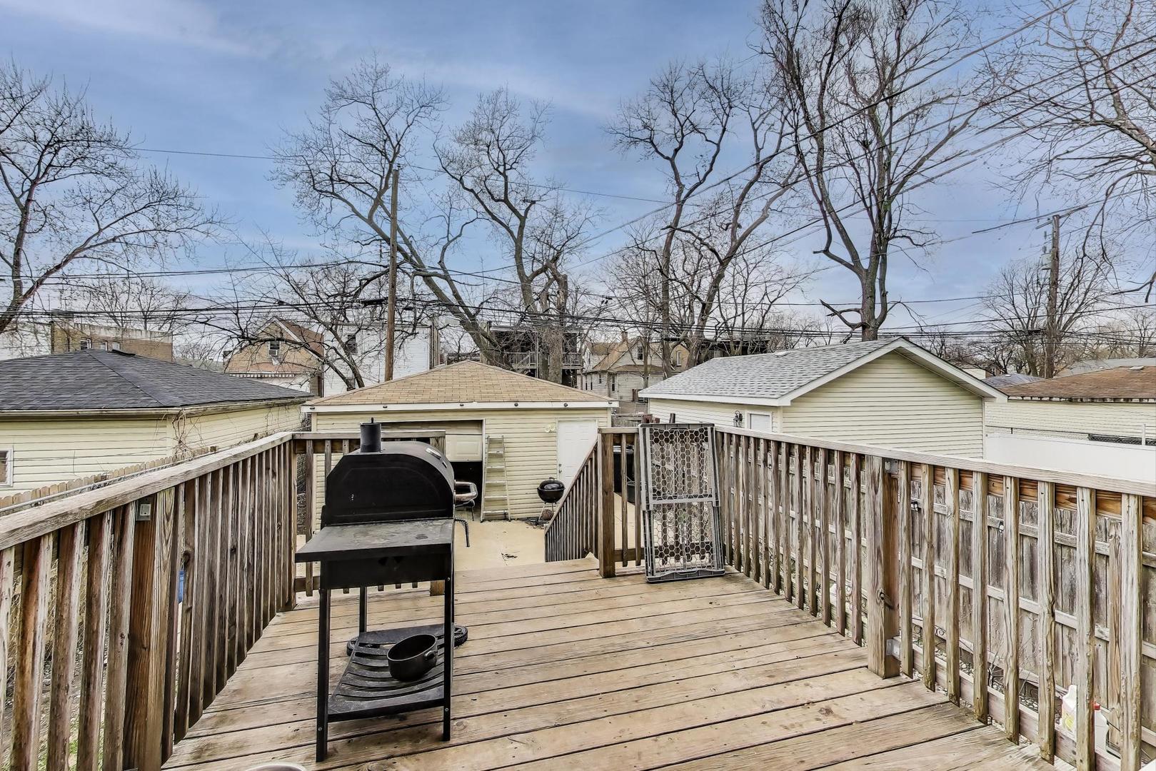 8618 South Morgan Street Chicago, IL 60620 - Photo 22 of 27 a view of a wooden deck and outdoor space