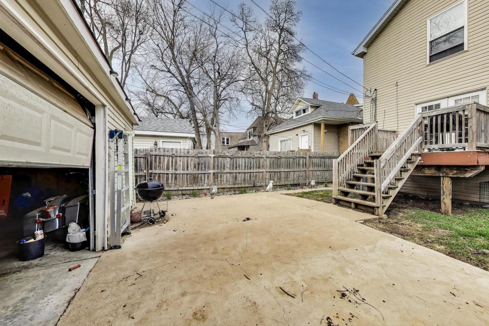8618 South Morgan Street Chicago, IL 60620 - Photo 23 of 27 a view of the house with a snow on the road