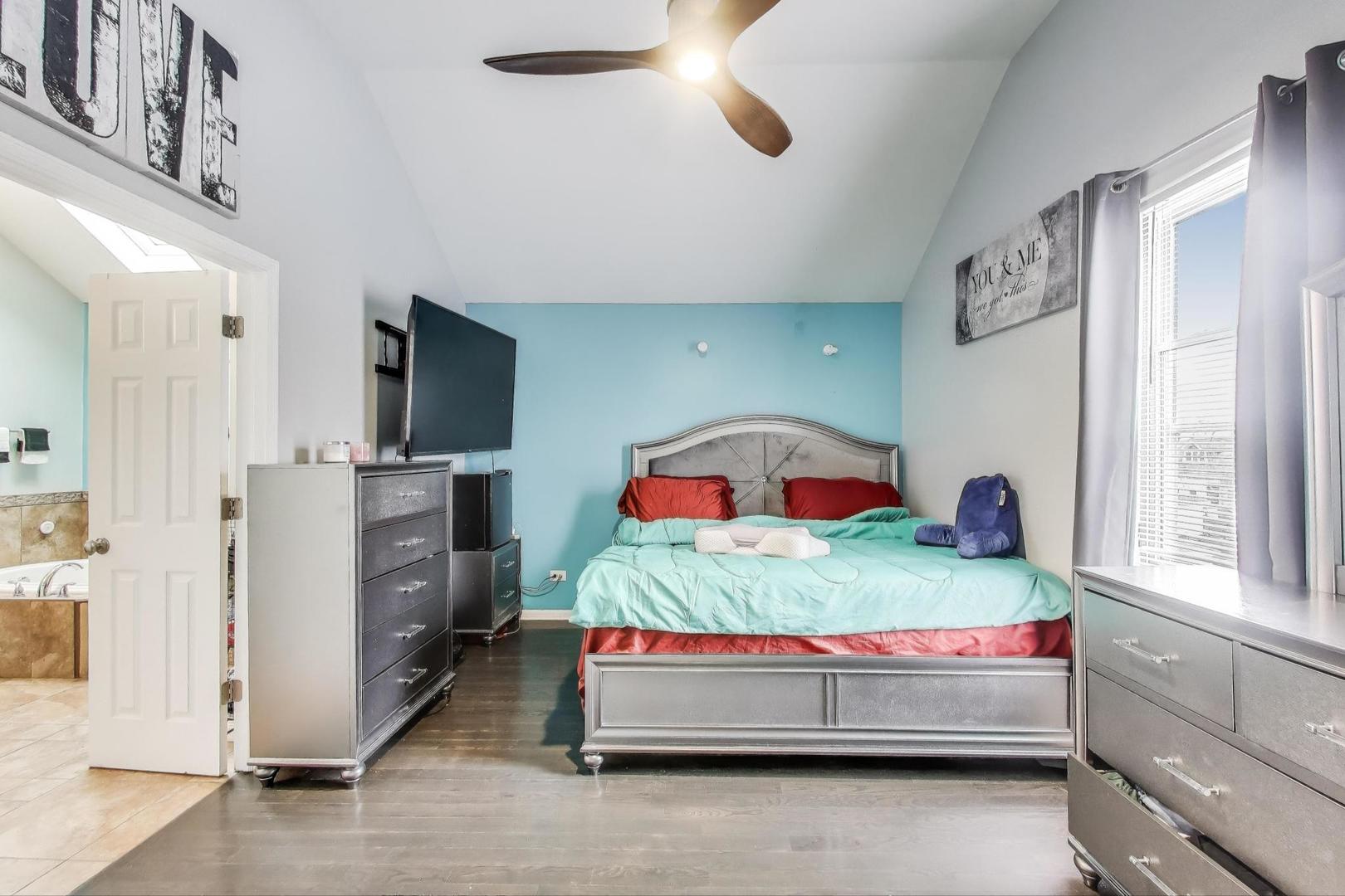 8618 South Morgan Street Chicago, IL 60620 - Photo 10 of 27 a bedroom with a bed and a painting on the wall