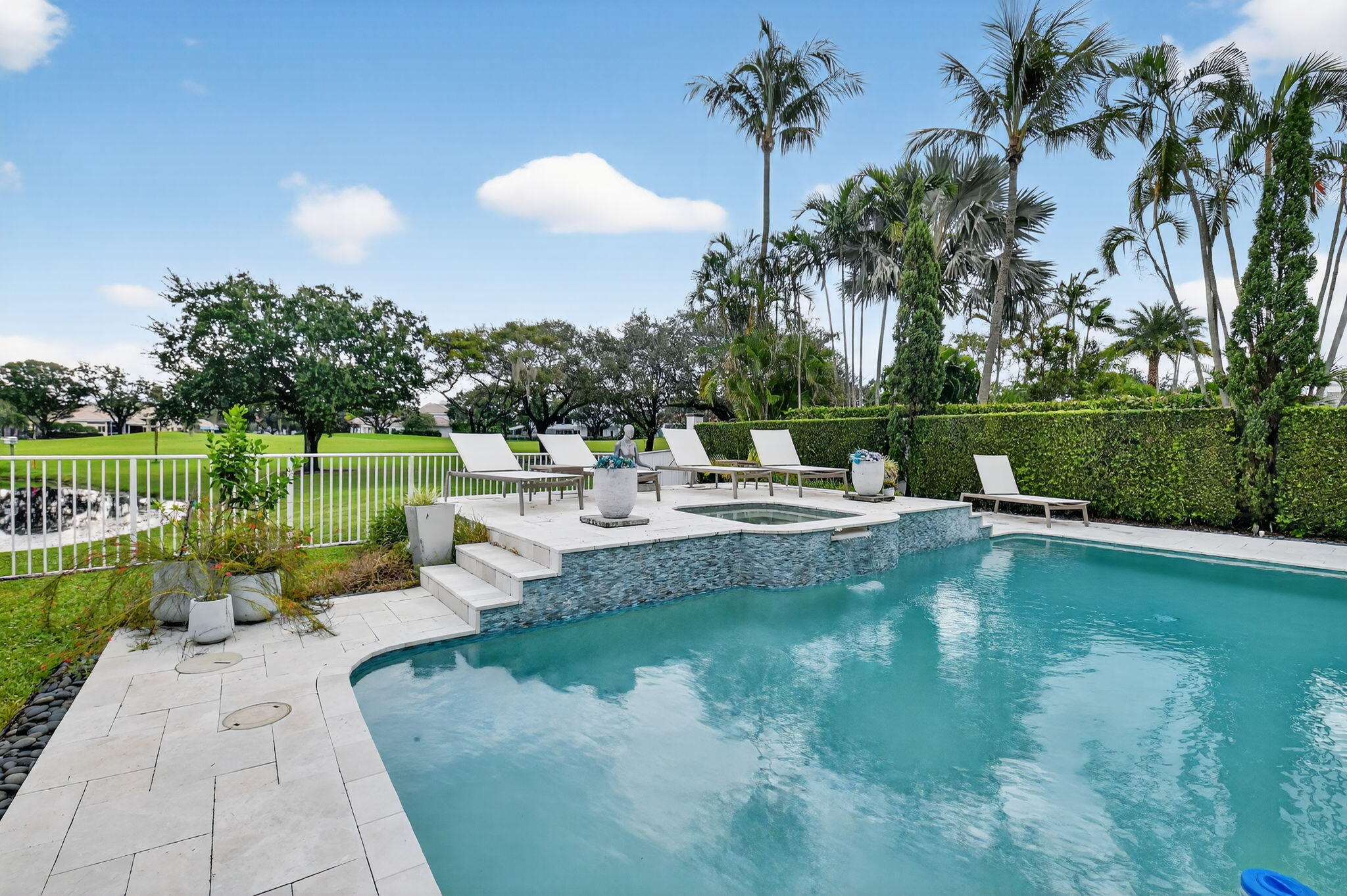 2563 Northwest 63rd Street Boca Raton, FL 33496 - Photo 50 of 65 a view of a lake with a garden and swimming pool