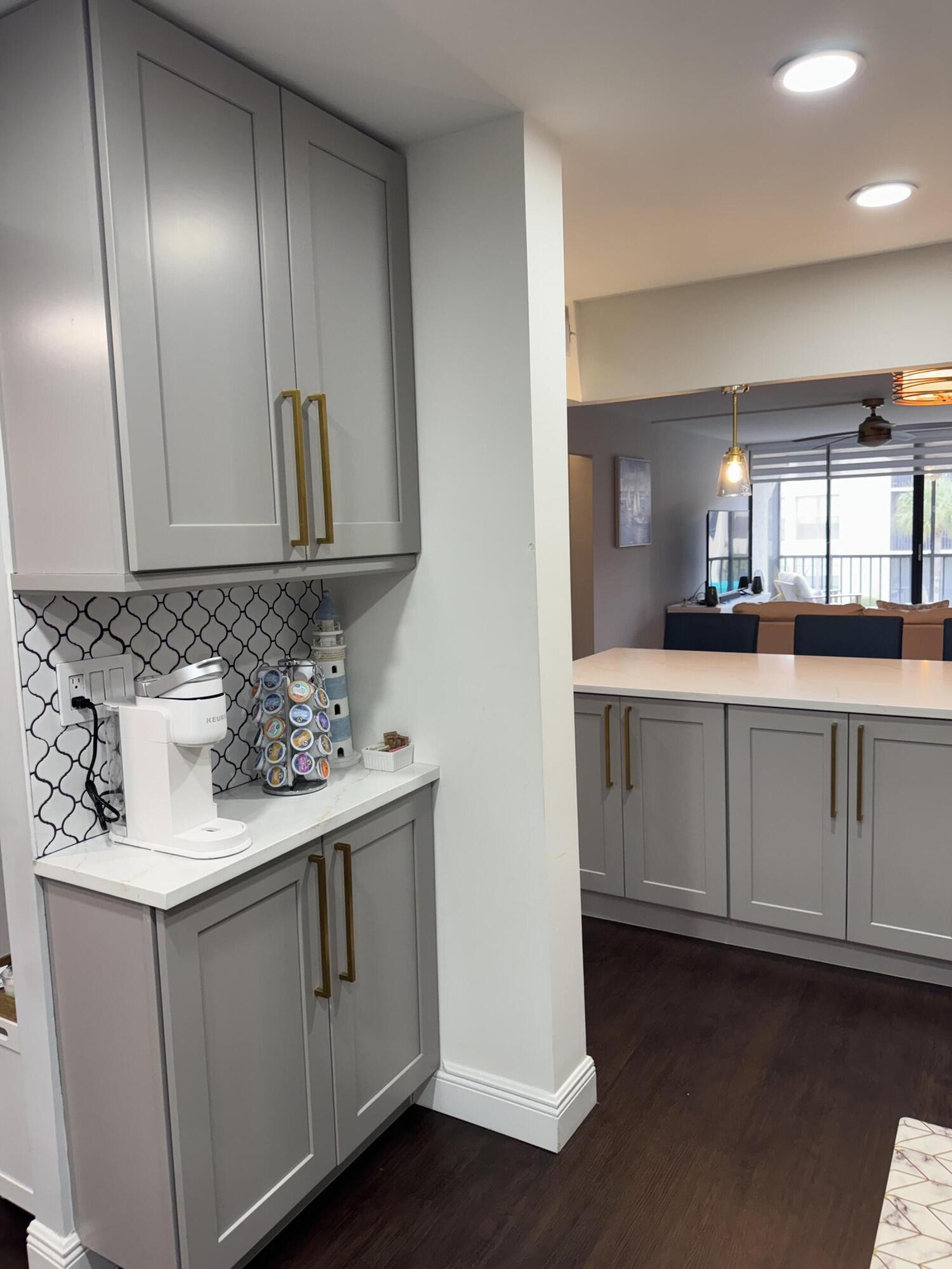 6 Royal Palm Way, Unit 202 Boca Raton, FL 33432 - Photo 17 of 29 a kitchen with white cabinets
