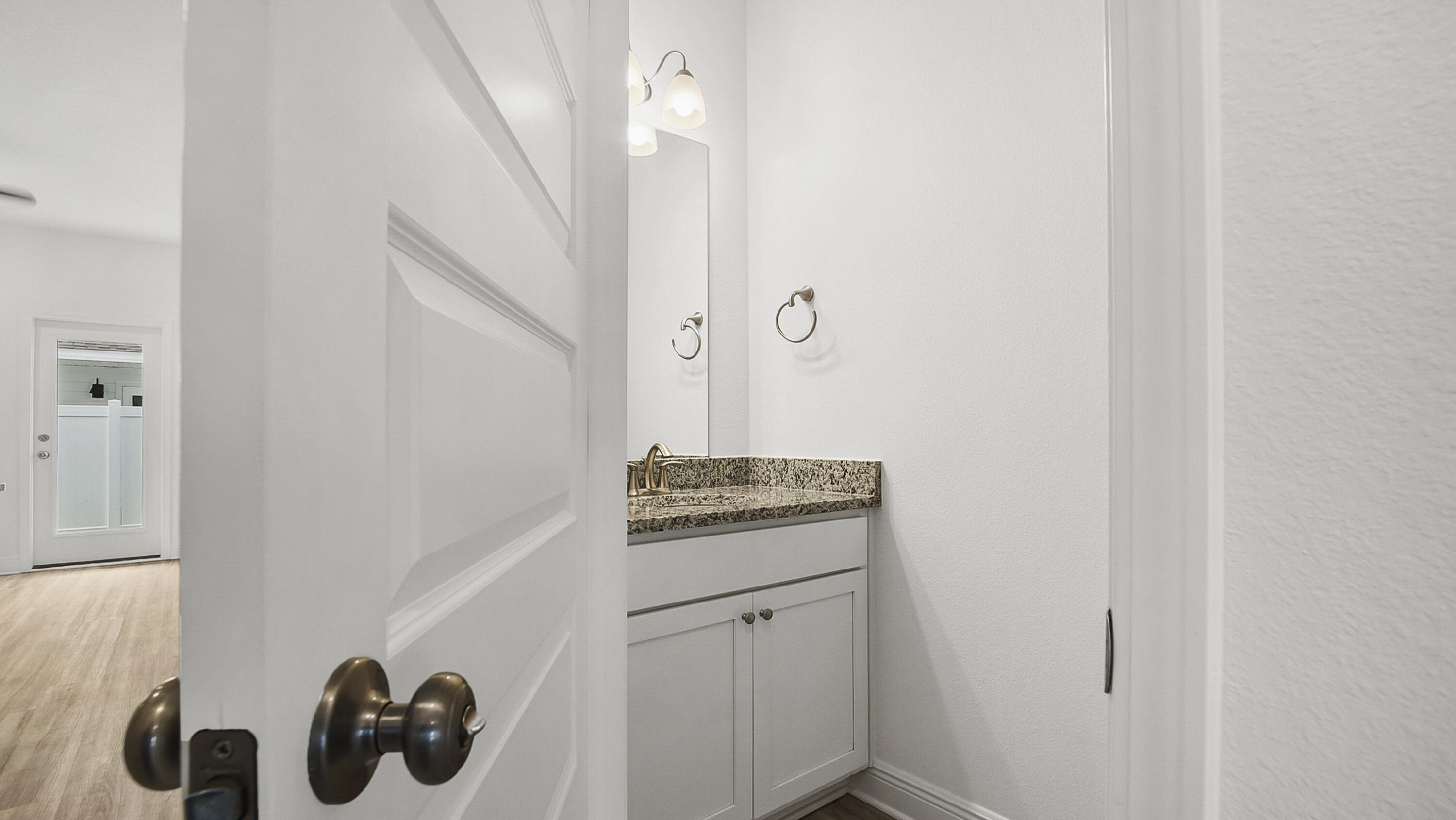 51 Phoenix Street Santa Rosa Beach, FL 32459 - Photo 15 of 34 a kitchen with a sink and cabinets