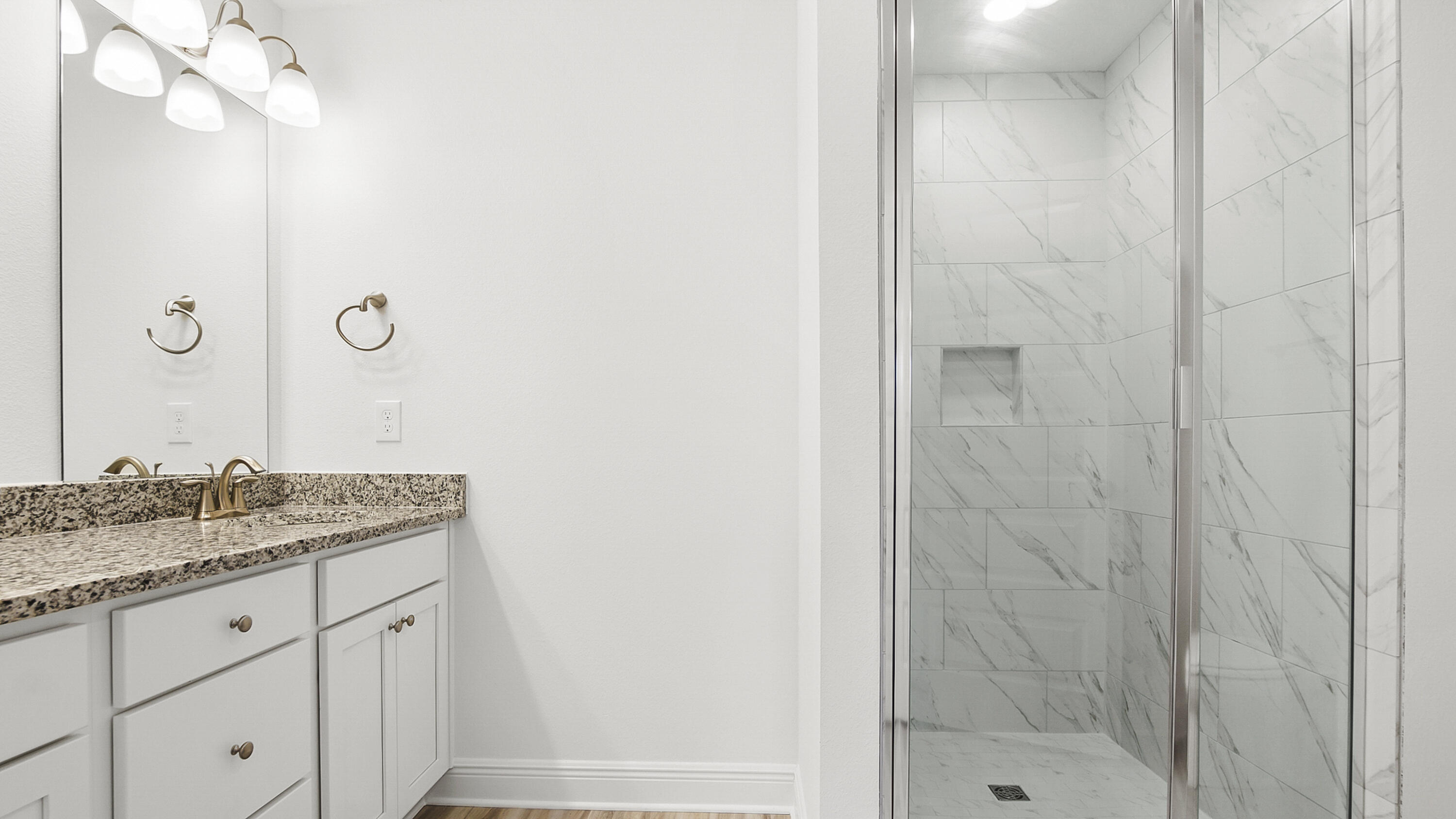 51 Phoenix Street Santa Rosa Beach, FL 32459 - Photo 21 of 34 a bathroom with a granite countertop sink a mirror and shower