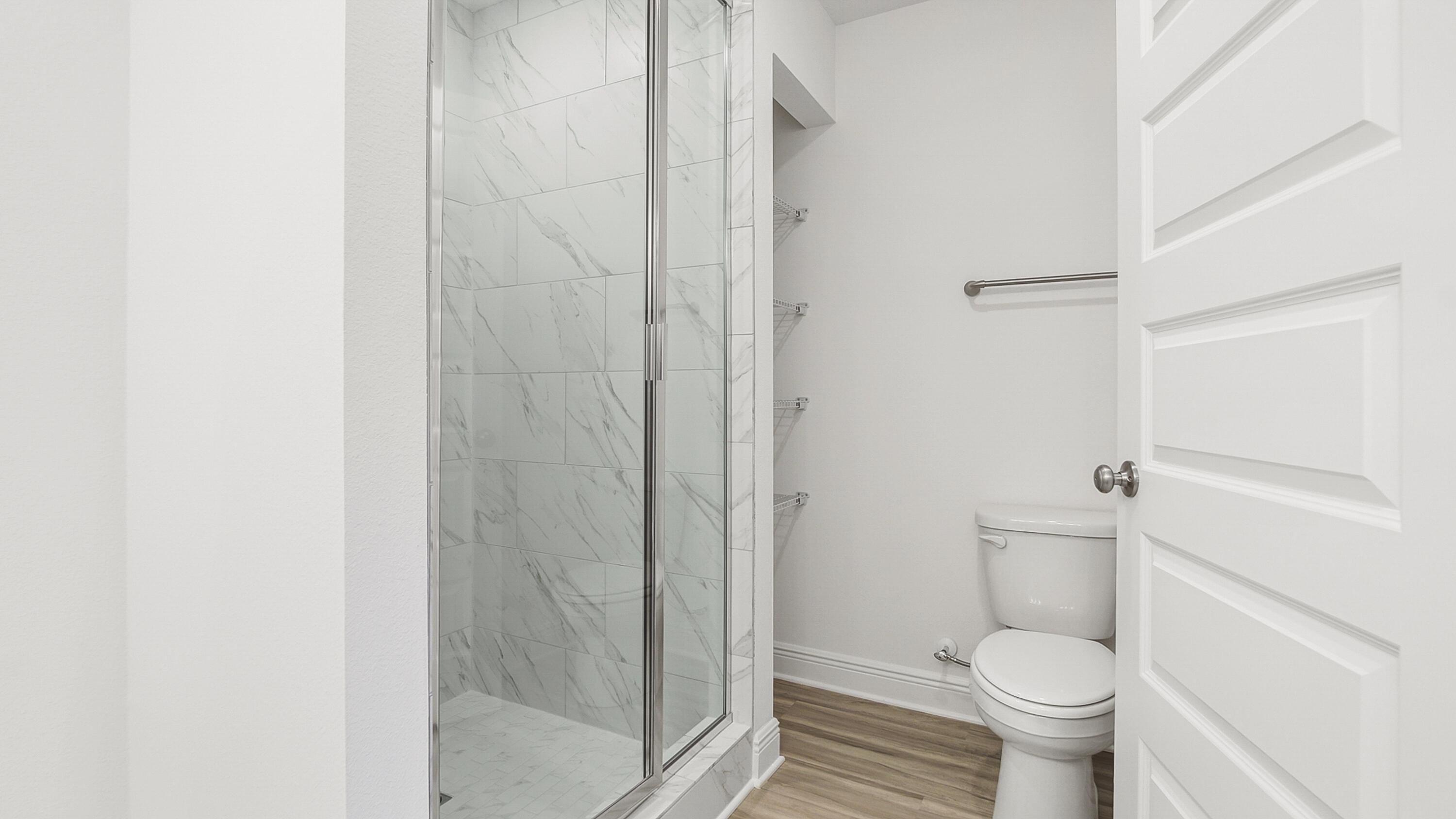 51 Phoenix Street Santa Rosa Beach, FL 32459 - Photo 22 of 34 a bathroom with a granite countertop toilet and a shower