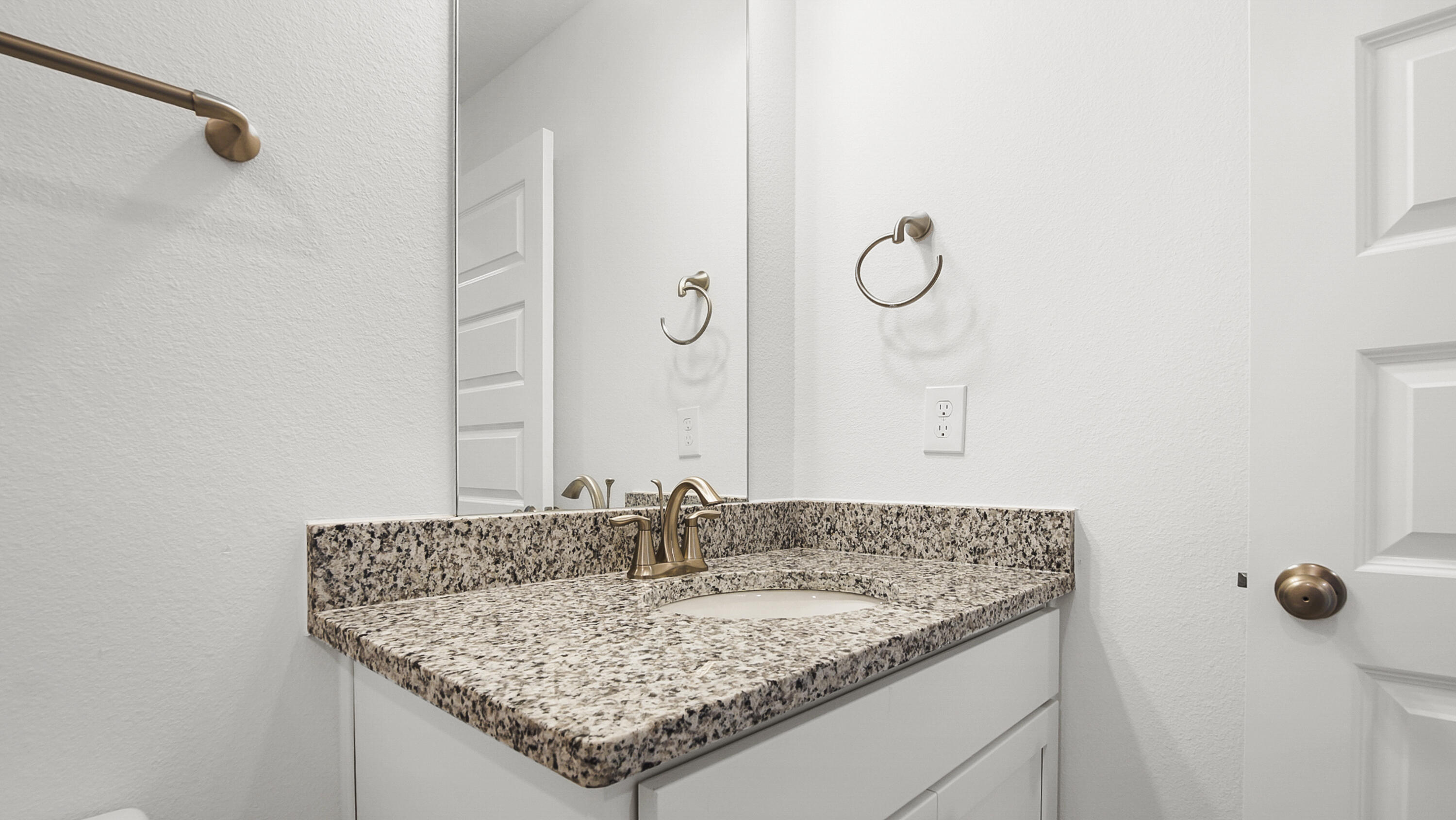 51 Phoenix Street Santa Rosa Beach, FL 32459 - Photo 29 of 34 a bathroom with a granite countertop sink and a mirror