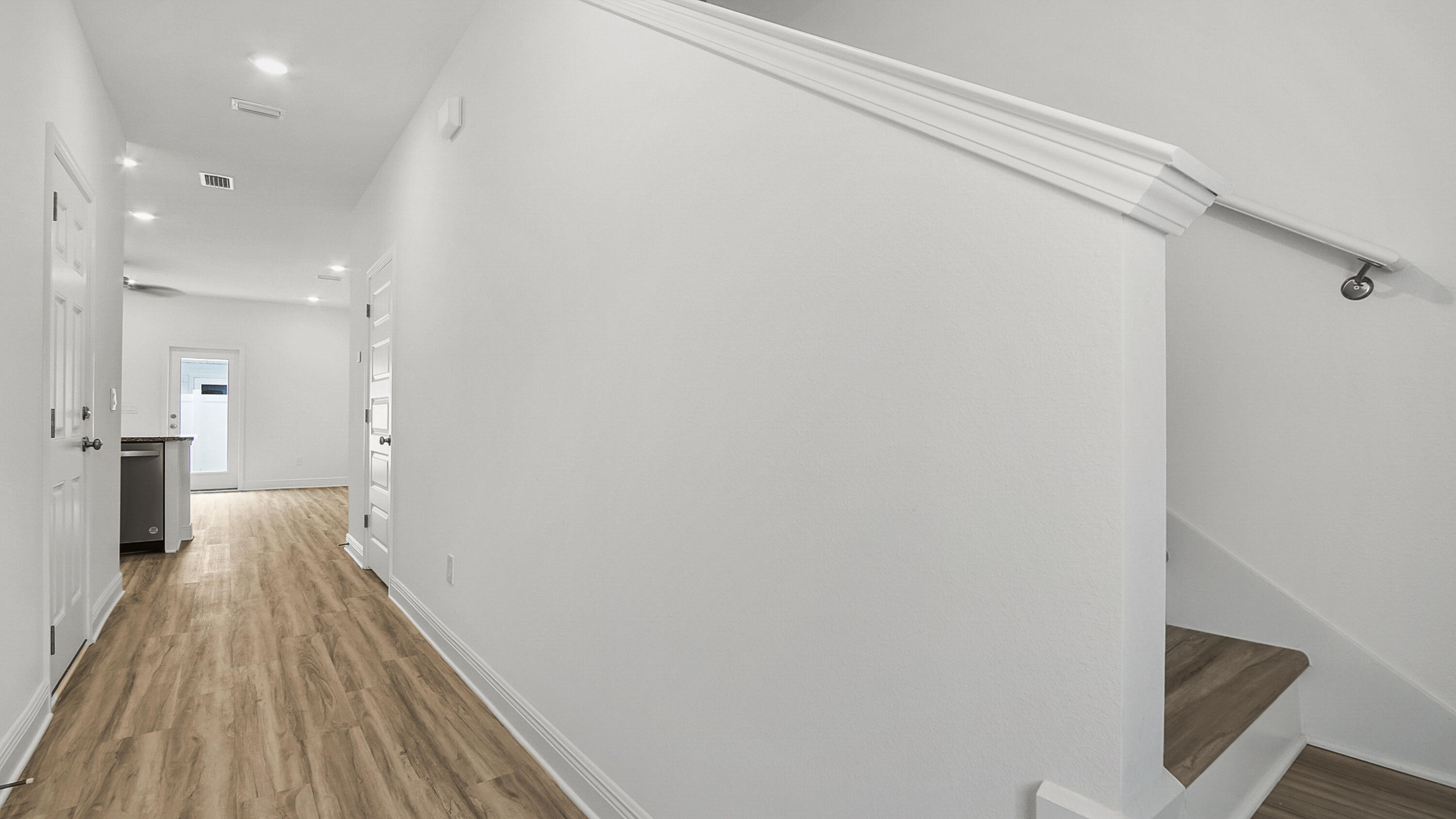 51 Phoenix Street Santa Rosa Beach, FL 32459 - Photo 3 of 34 a view of a room with wooden floor and a bathroom
