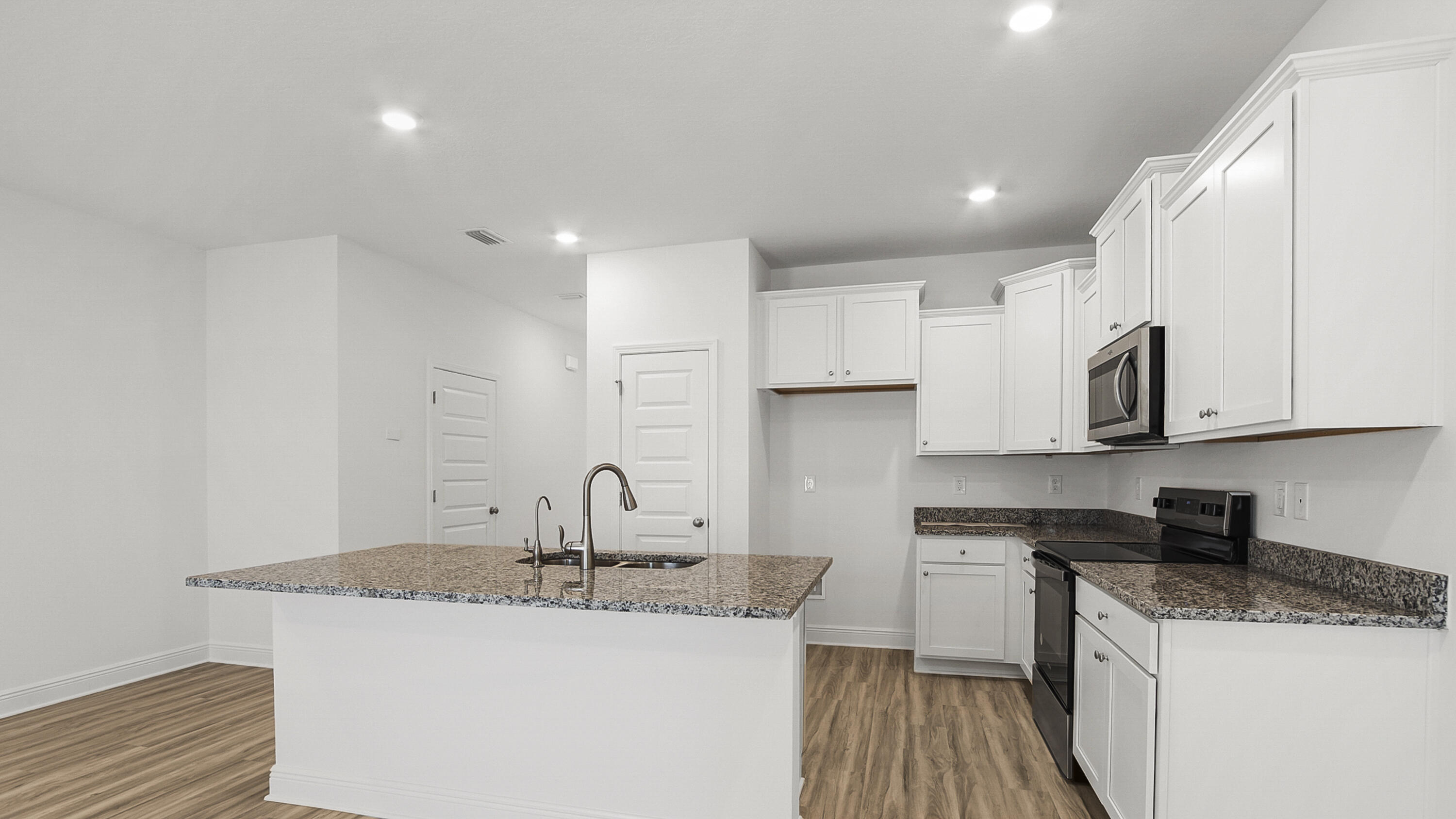 51 Phoenix Street Santa Rosa Beach, FL 32459 - Photo 9 of 34 a kitchen with stainless steel appliances granite countertop a sink stove and cabinets