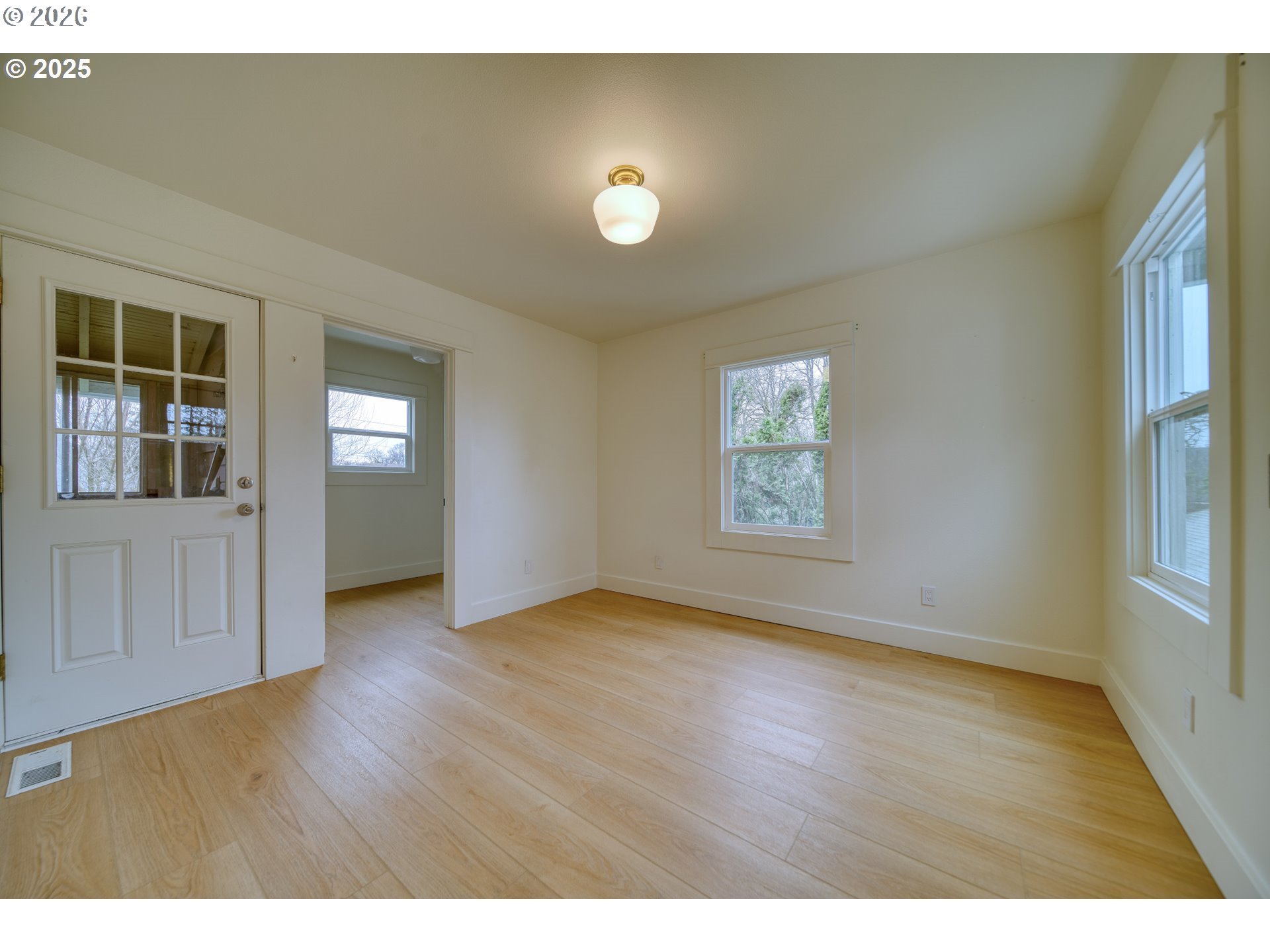 296 North 4th Street St. Helens, OR 97051 - Photo 10 of 17 a view of an empty room with window and wooden floor