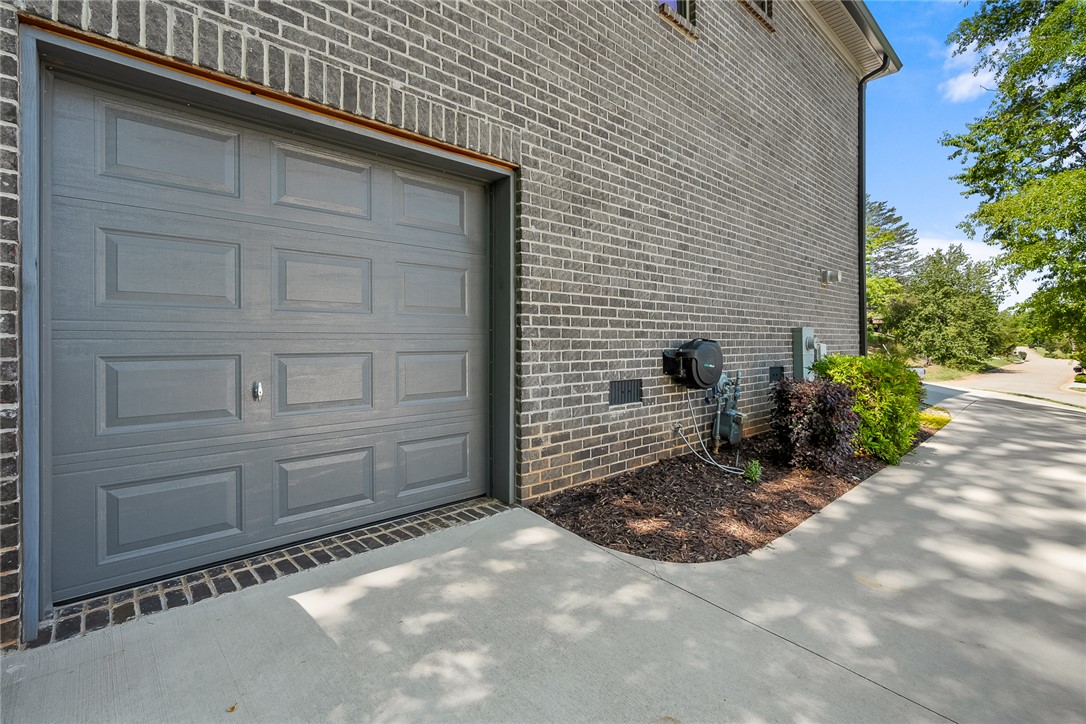140 Turnberry Road Anderson, SC 29621 - Photo 34 of 44 This residence features a sturdy brick exterior and a convenient attached garage.