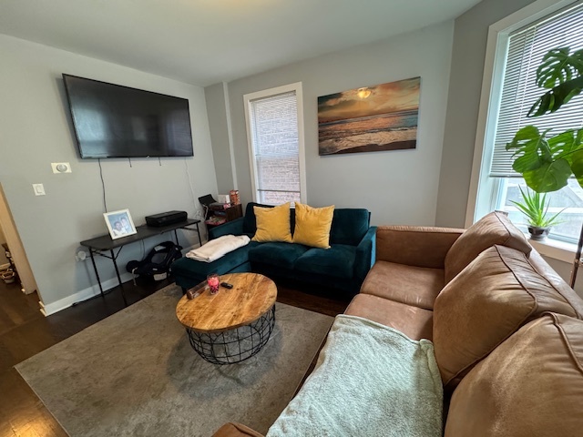 1431 North Springfield Avenue, Unit 2 Chicago, IL 60651 - Photo 4 of 19 a living room with furniture and a flat screen tv