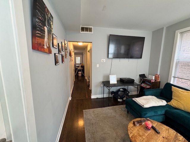1431 North Springfield Avenue, Unit 2 Chicago, IL 60651 - Photo 5 of 19 a living room with furniture and a flat screen tv