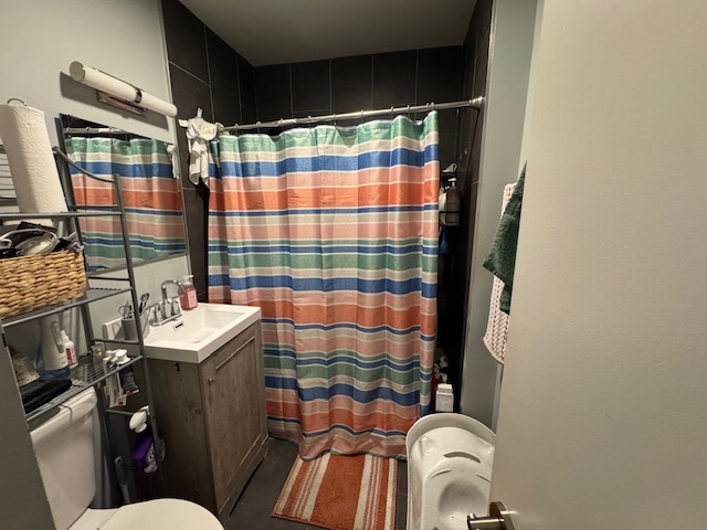 1431 North Springfield Avenue, Unit 2 Chicago, IL 60651 - Photo 7 of 19 a bathroom with a sink toilet and shower