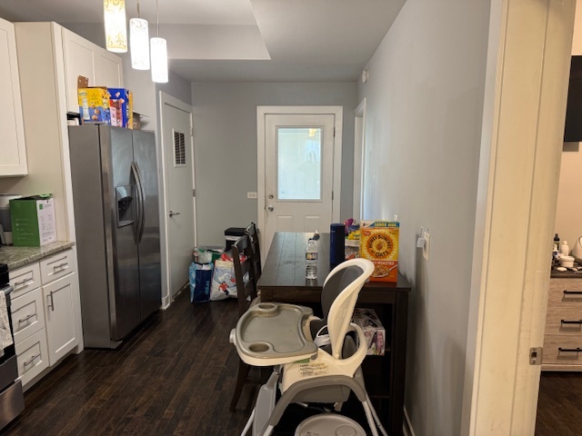 1431 North Springfield Avenue, Unit 2 Chicago, IL 60651 - Photo 9 of 19 a hallway with a closet and a mirror