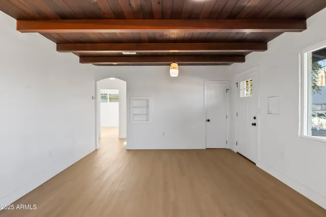 a front view of a house with a big yard