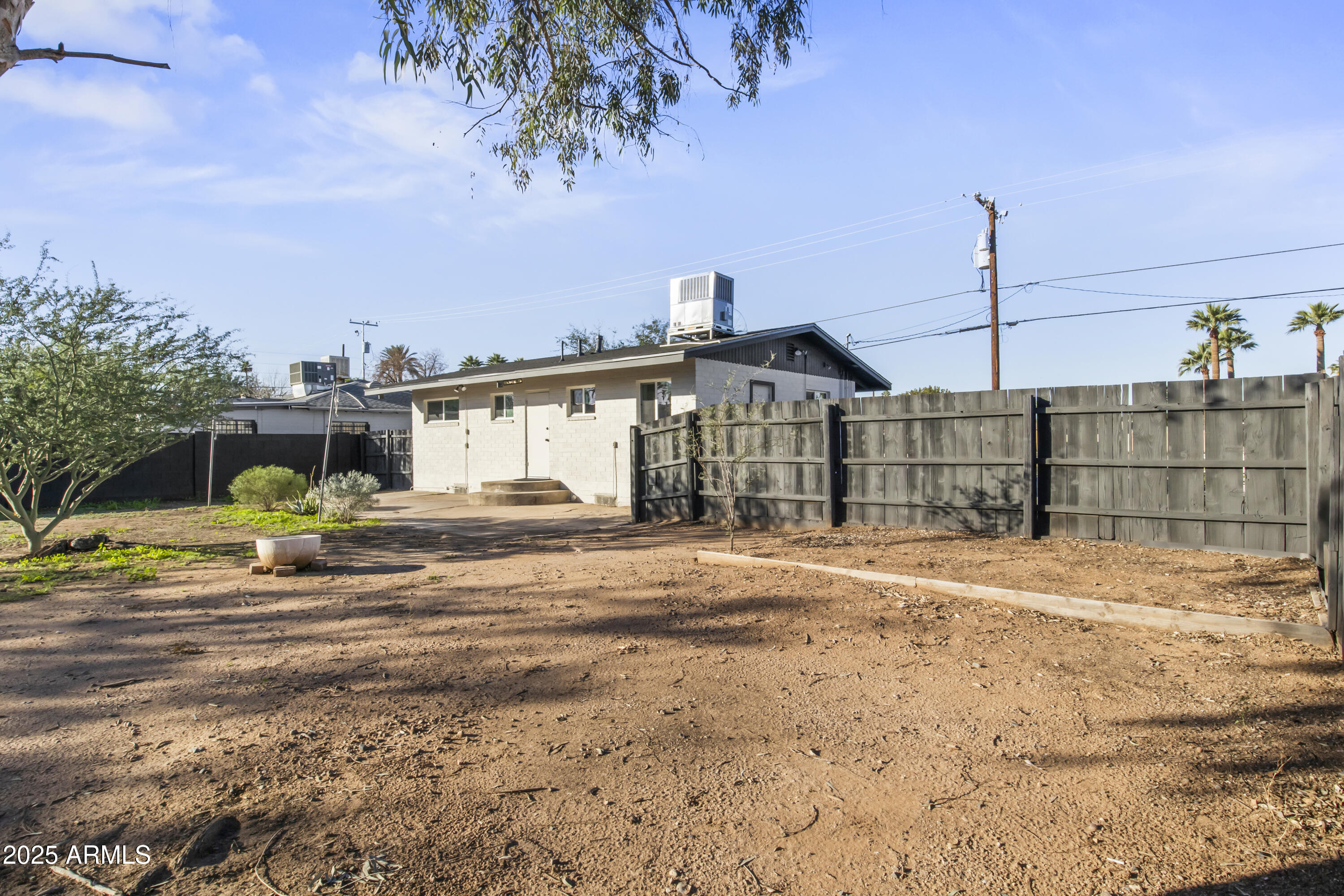 2621 North 14th Street Phoenix, AZ 85006 - Photo 30 of 36 a front view of a house with a yard and garage