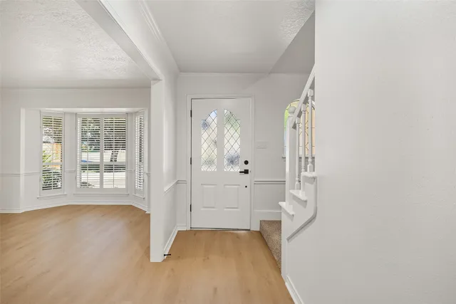 wooden floor in an empty room and a window