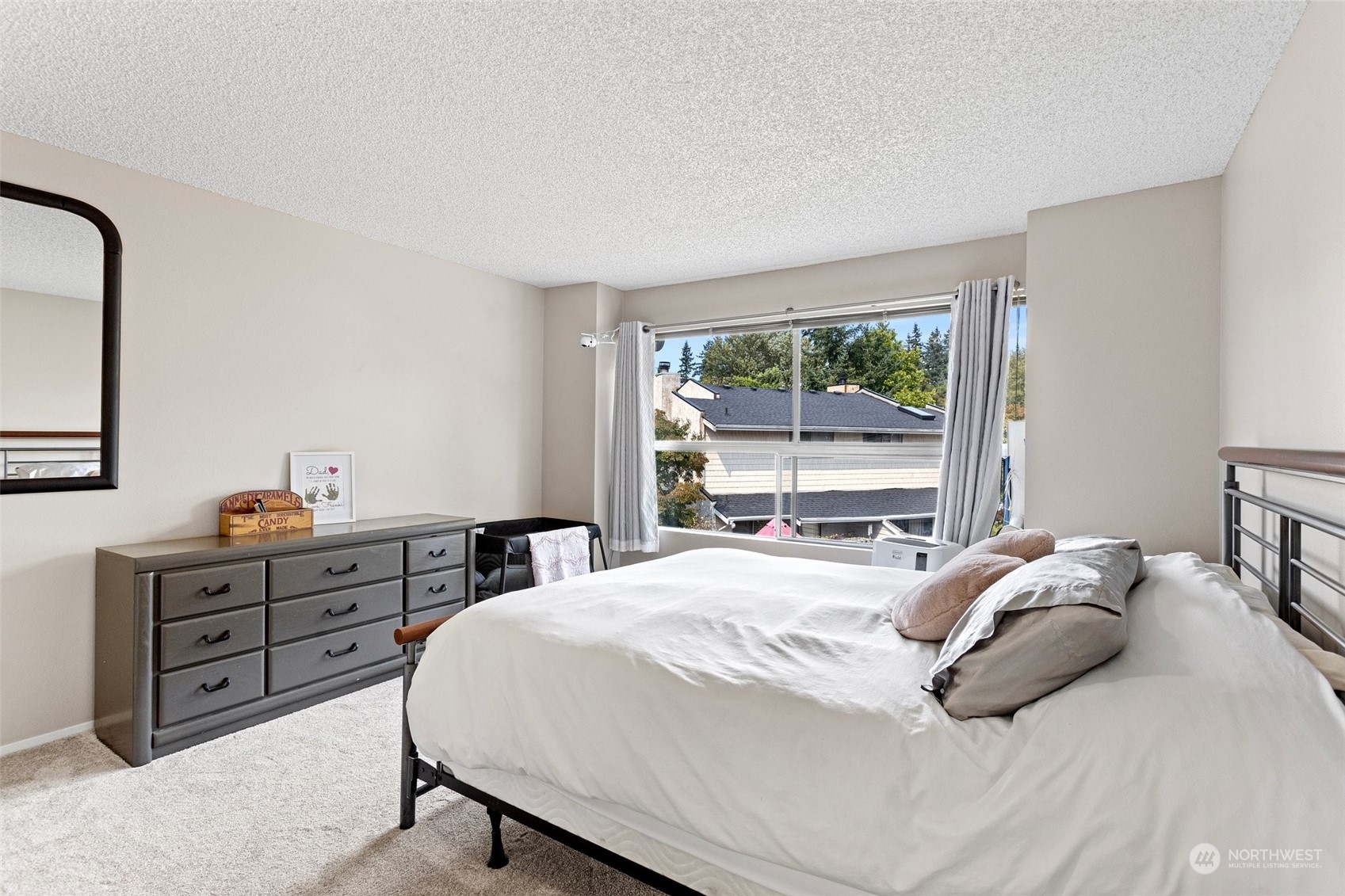 9110 Park Road, Unit 300L Edmonds, WA 98026 - Photo 13 of 27 a bedroom with a bed and a window