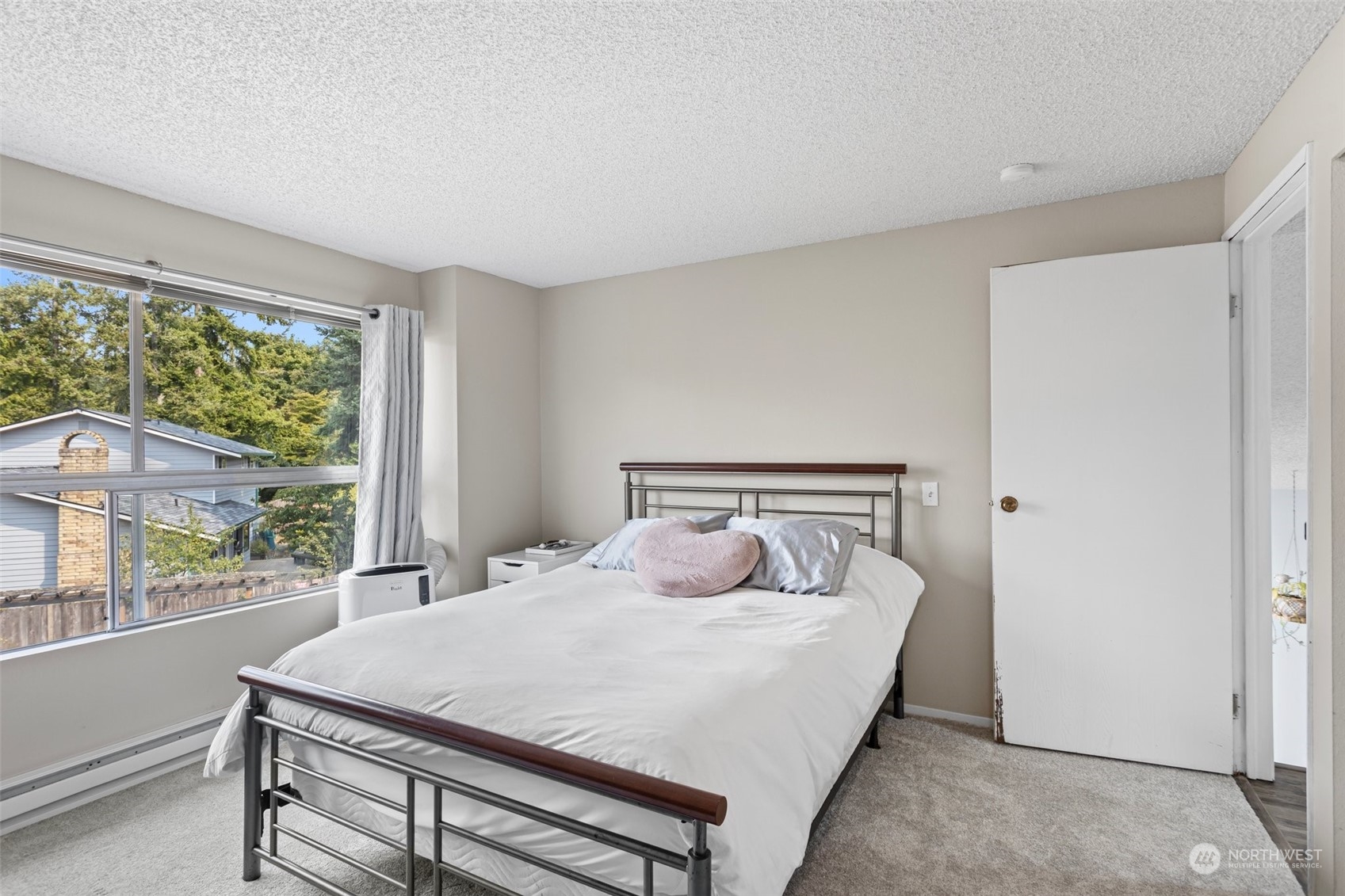 9110 Park Road, Unit 300L Edmonds, WA 98026 - Photo 14 of 27 a bedroom with a bed and a large window