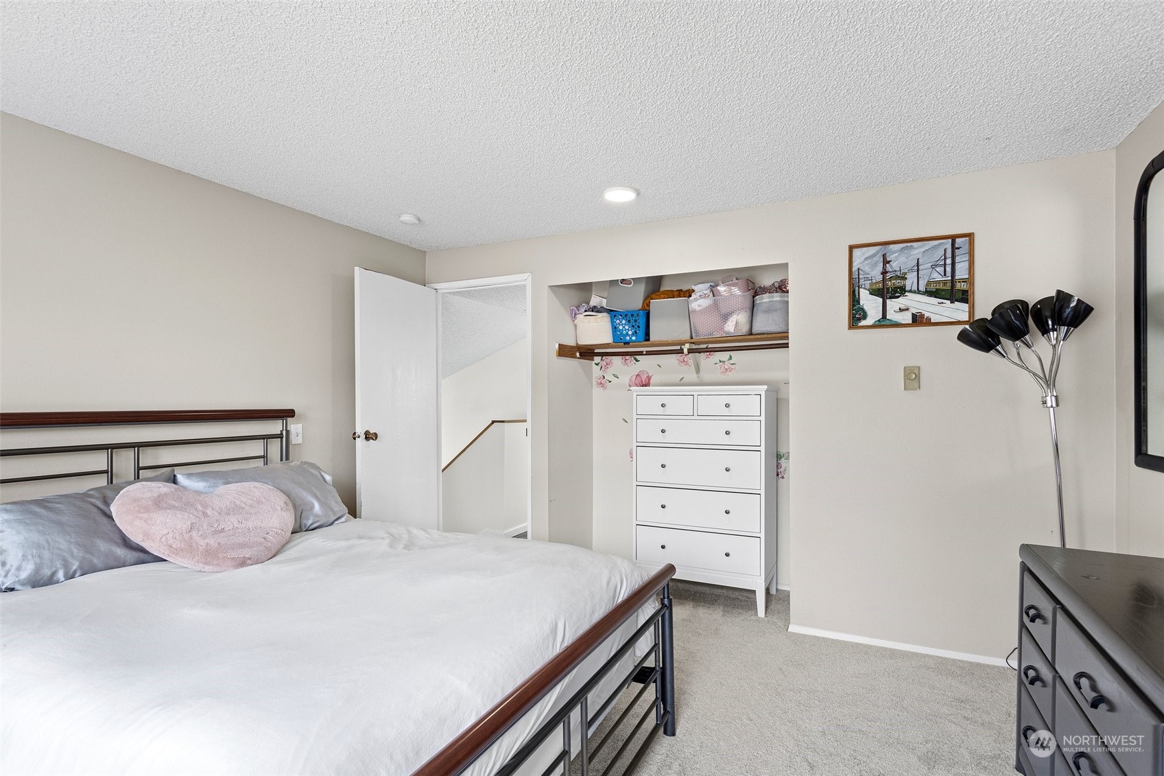 9110 Park Road, Unit 300L Edmonds, WA 98026 - Photo 15 of 27 a bedroom with a bed and a cabinets