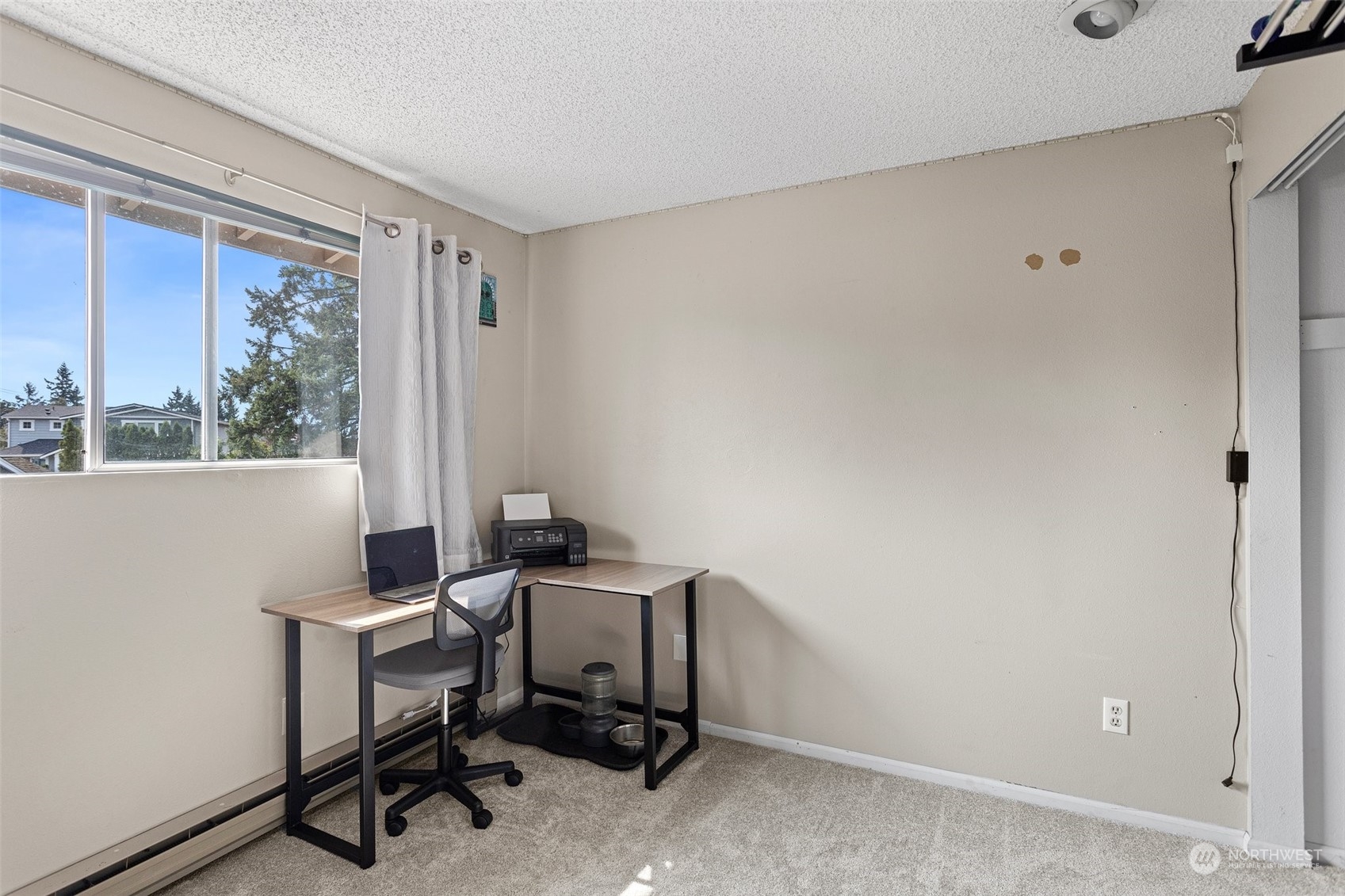 9110 Park Road, Unit 300L Edmonds, WA 98026 - Photo 16 of 27 a view of a workspace with furniture and a window