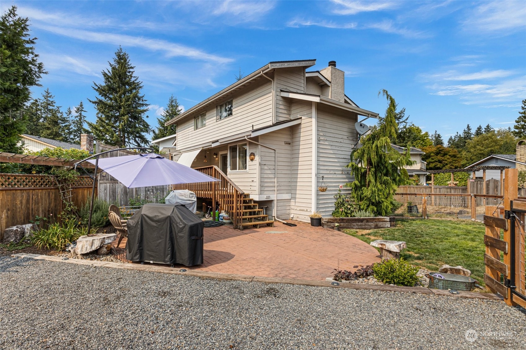 9110 Park Road, Unit 300L Edmonds, WA 98026 - Photo 20 of 27 a view of a house with backyard and sitting area