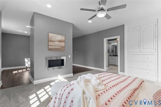 a bedroom with a bed and a television