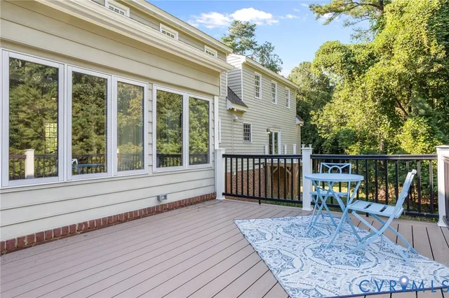 a view of a house with wooden deck