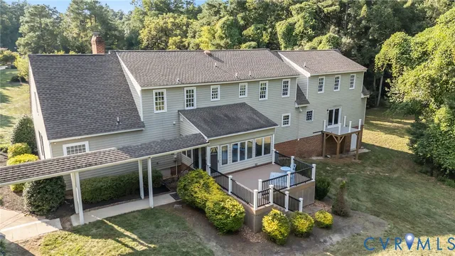a aerial view of a house with garden and plants