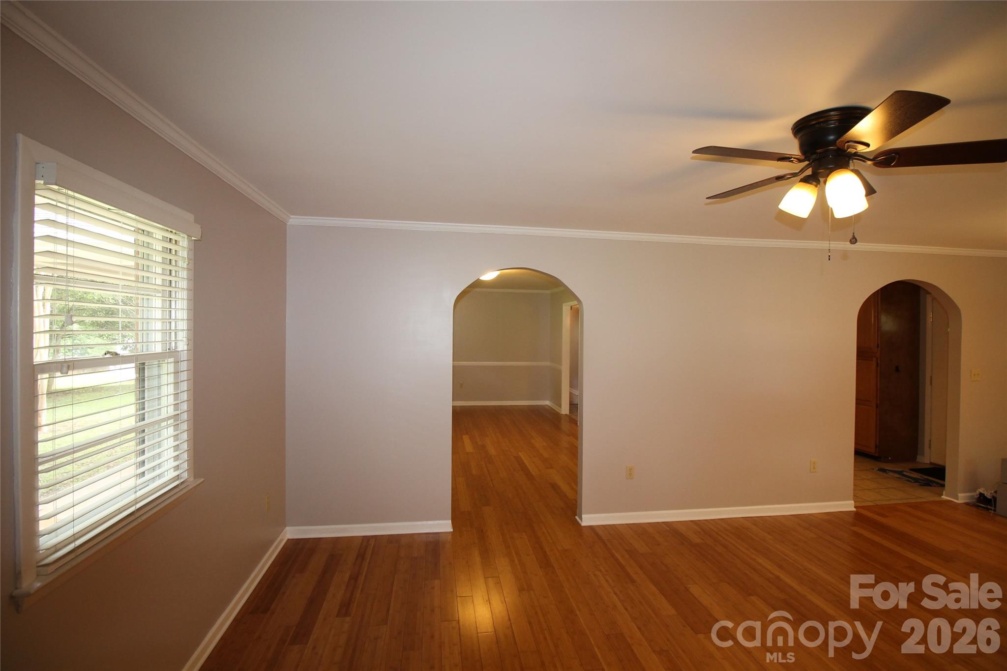 203 Ratchford Farm Road Gastonia, NC 28056 - Photo 13 of 38 a view of empty room with wooden floor and fan
