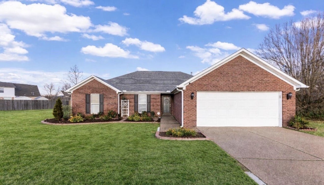 23 Matrix Cove Jackson, TN 38305 - Photo 1 of 16 a front view of house with yard