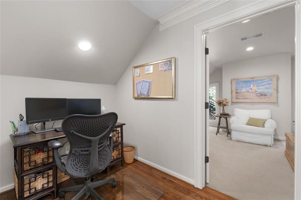 310 Glen Hampton Place Alpharetta, GA 30004 - Photo 20 of 61 a living room with furniture and a wooden floor