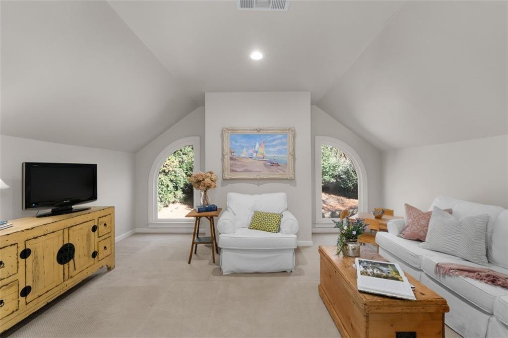 310 Glen Hampton Place Alpharetta, GA 30004 - Photo 21 of 61 a living room with furniture and a flat screen tv