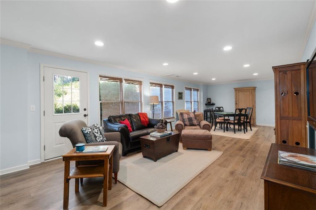 310 Glen Hampton Place Alpharetta, GA 30004 - Photo 29 of 61 a living room with furniture or wooden floor and a potted plant