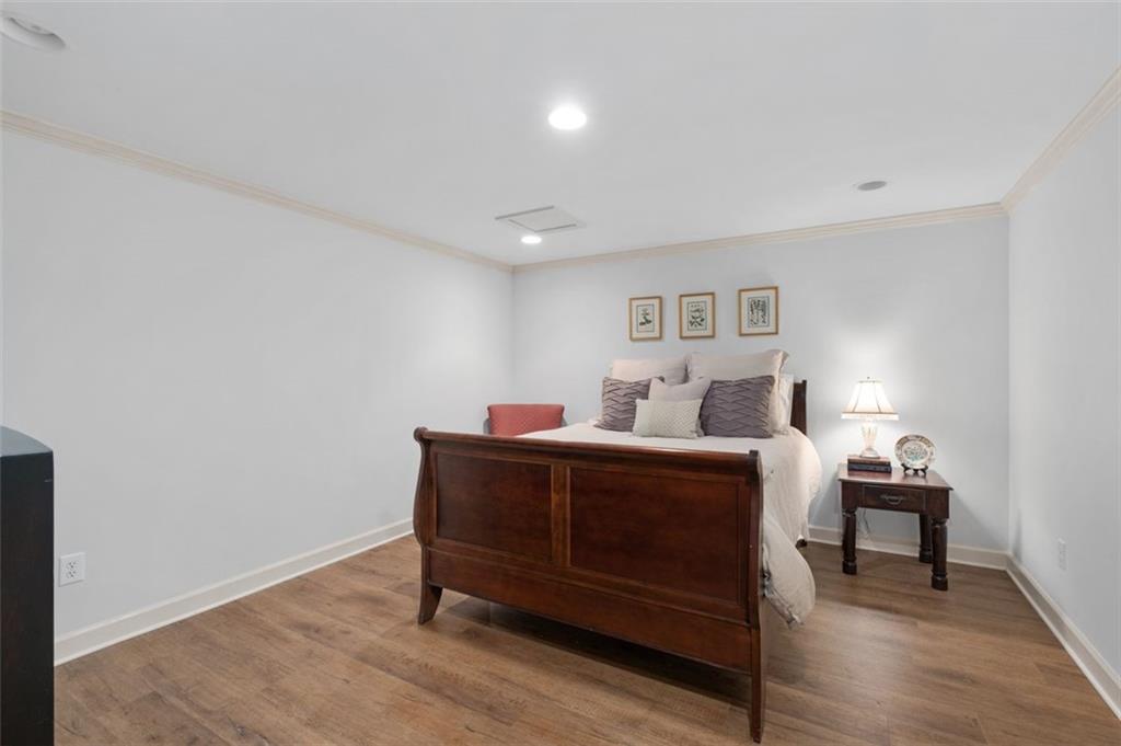 310 Glen Hampton Place Alpharetta, GA 30004 - Photo 32 of 61 a bed room with a bed and a lamp